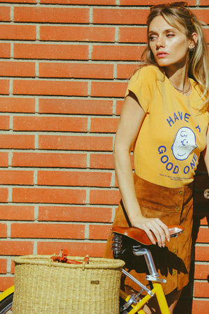 
                  
                    peanuts have a good one baby tee marigold
                  
                