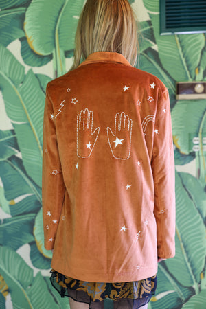 
                  
                    cosmic velvet jacket in rust
                  
                