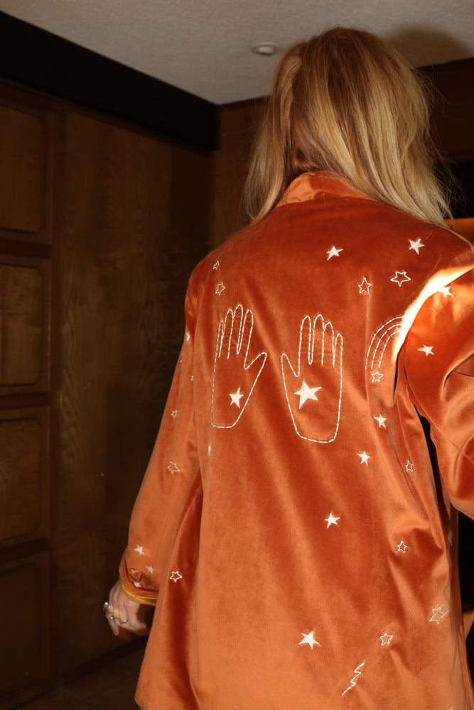 
                  
                    cosmic velvet jacket in rust
                  
                