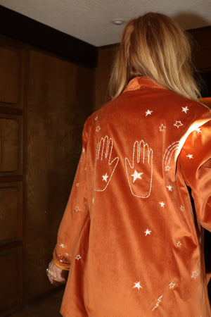 
                  
                    cosmic velvet jacket in rust
                  
                