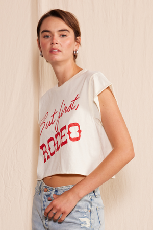
                  
                    "But First, Rodeo" Crop Top
                  
                