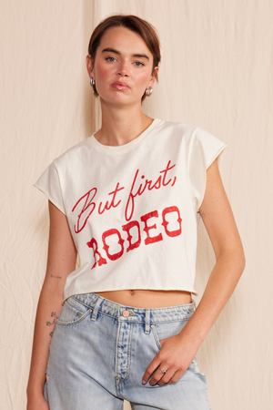 
                  
                    "But First, Rodeo" Crop Top
                  
                