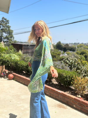 
                  
                    Blowin' in the Wind top
                  
                