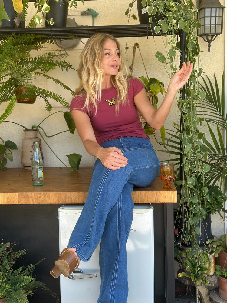
                  
                    Butterflies Are Free Tee in plum
                  
                
